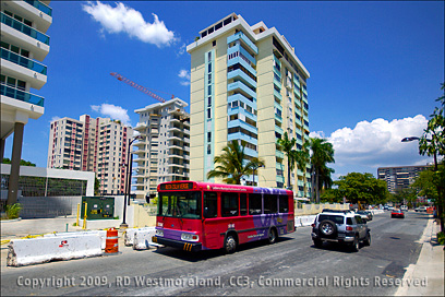 Hotel Construction with Colorful Bus in the Foreground in Isla Verde Near the Airport of San Juan, Puerto Rico
