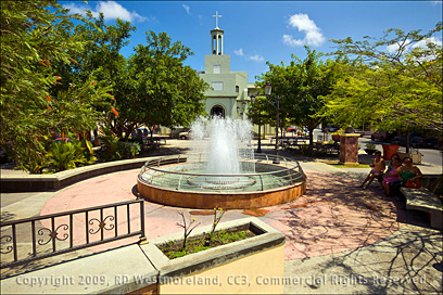 Water Fountain on the Plaza of Rincon with the Catholic Church in the Background in Puerto Rico