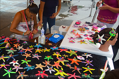 Artesano Selling Hand Painted Star Fish in Corozal, Puerto Rico