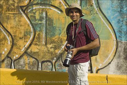 Member of San Juan Photo Club Pausing for Shot, Puerto Rico