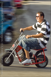 Kid on a Mini-Bike During San Blas Marathon Celebration in Coamo, Puerto Rico