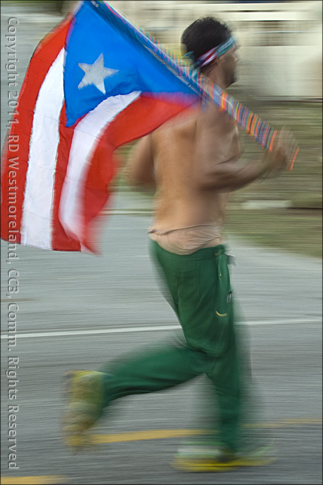 Runner Carrying Flag of Puerto Rico During the San Blas Half Marathon of Coamo, Puerto Rico