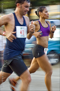 Two Runners at the 15 Kilometer Mark of the San Blas Half Marathon of Coamo, Puerto Rico