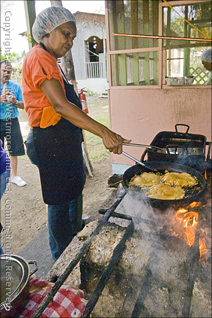 El Fogon De Suza of Jobos Frying Bacalaito on Open Hearth in Puerto Rico