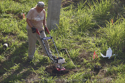 Roberto Working the Garden with a Mantis Roto-Tiller