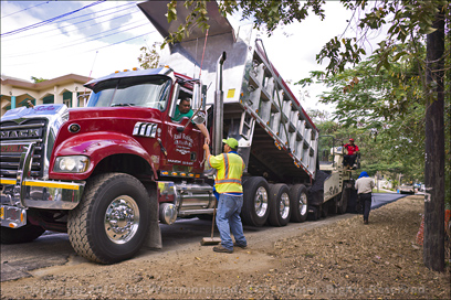 An Asphalt Truck Dumping its Load During the Re-Paving of Highway 150 in Coamo, Puerto Rico