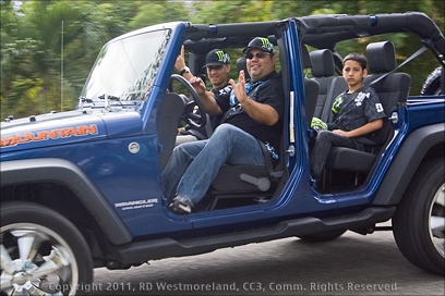 Happy family in a blue Jeep