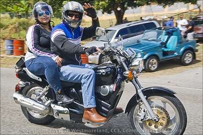 One More couple sharing a motorcycle