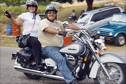 Happy couple touring via motorcycle